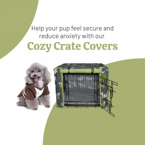 A small white dog wearing a cozy coat sits next to a dog crate covered with a patterned cover.