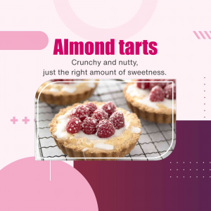 Close-up of almond tarts with raspberries and powdered sugar