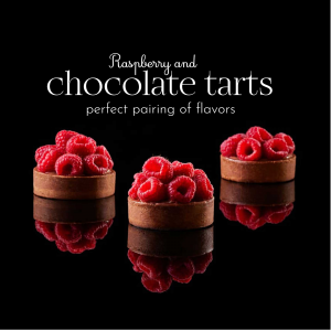 Three raspberry and chocolate tarts on a black reflective surface