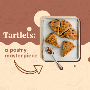 Close-up of chocolate chip tartlets on a baking sheet with a spoon