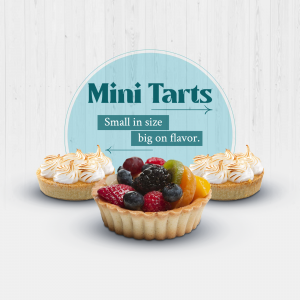 Close-up of mini fruit tarts with meringue topping and fresh berries