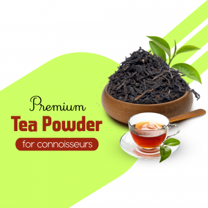Close-up of premium black tea powder in a wooden bowl with a cup of tea