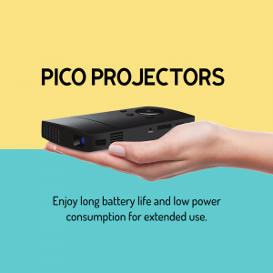 A hand holding a small black pico projector against a two-tone blue and yellow background.