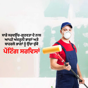 A painter wearing a mask and overalls while painting a wall.