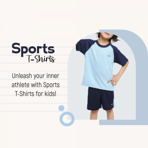 A young boy wearing a blue and navy sports t-shirt and shorts.