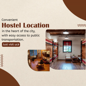 Interior view of a hostel room with bunk beds and common area.