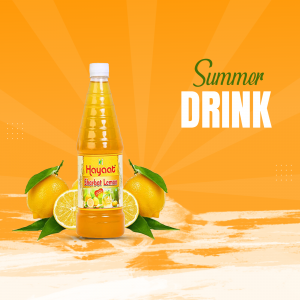 A bottle of Hayat lemon drink with lemons and lemon slices on a sandy beach background.
