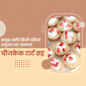 Close-up of cheesecake tarts topped with fresh strawberries and whipped cream.