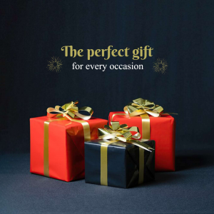 Three gift boxes with gold ribbons on a dark background