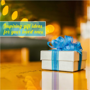Gift box with a blue ribbon on a reflective surface