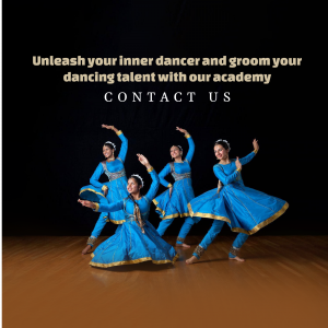 Four female dancers in traditional blue Indian attire performing classical dance.