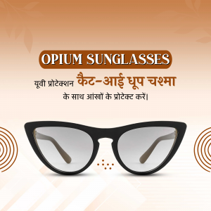 Black cat-eye sunglasses with gold detailing on a gradient orange background.