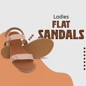 Close-up of beige ladies flat sandals with buckle detail