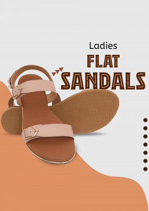 Close-up of a pair of beige ladies flat sandals with a buckle detail.