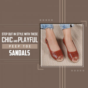 Close-up of red peep toe sandals with a textured background.