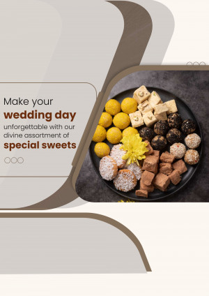 Assortment of Indian sweets on a black plate with floral garnish