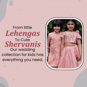Two young children, a boy and a girl, wearing traditional Indian wedding outfits - a sherwani and a lehenga.