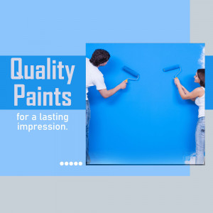 Couple painting a wall blue with quality paints