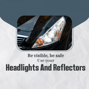 Close-up of a car headlight with text promoting headlight and reflector use for safety.