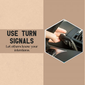 Close-up of a hand activating a turn signal in a car, with text reminding drivers to use their signals.