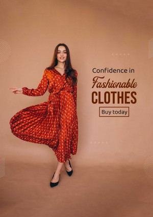 Woman in a flowing orange patterned dress promoting fashionable clothing.