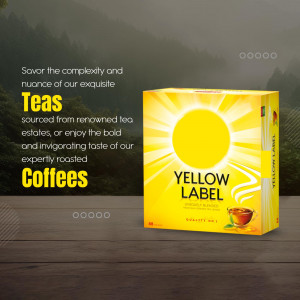 Yellow Label tea and coffee product packaging on a wooden surface with a blurred background.