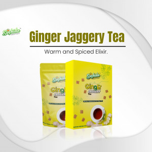Two packages of Sushida Ginger Jaggery Tea with a cup of tea and ginger root.