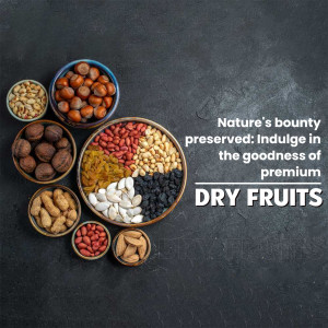 Assortment of colorful dry fruits in bowls on a dark stone surface