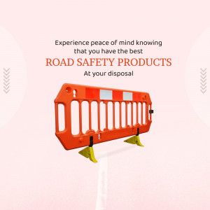 Orange road barrier with text promoting road safety