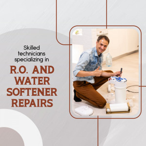 Technician repairing a water softener system