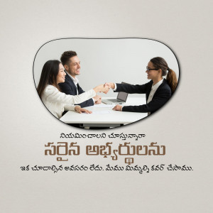 Two business professionals shaking hands across a desk during a job interview.