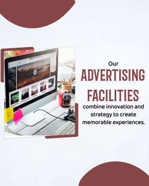 Laptop displaying advertising concepts with workspace elements