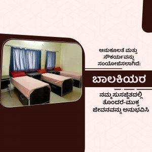 A room in a girls' hostel with multiple beds and basic furniture.