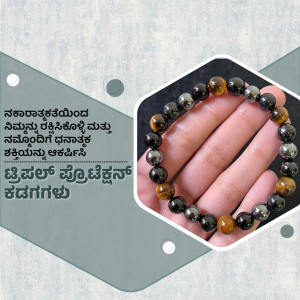 Close-up of a black and gold beaded bracelet on a hand