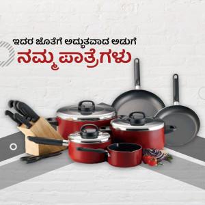 A collection of red and silver cookware including pots, pans, and knives on a grey surface.