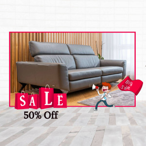 Gray leather sofa with a sale promotion featuring a 50% discount.