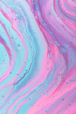 Close-up of vibrant pink and blue fluid art with swirling patterns