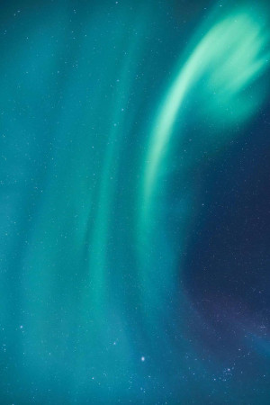 A stunning view of the Northern Lights dancing across the night sky.