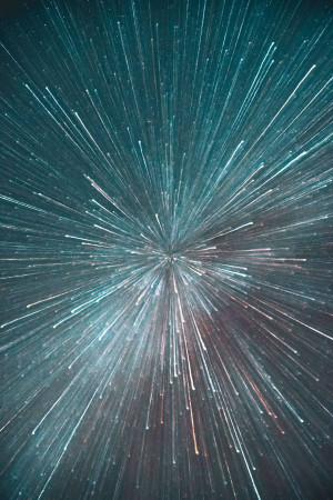 Abstract image of a starburst or explosion of light streaks.