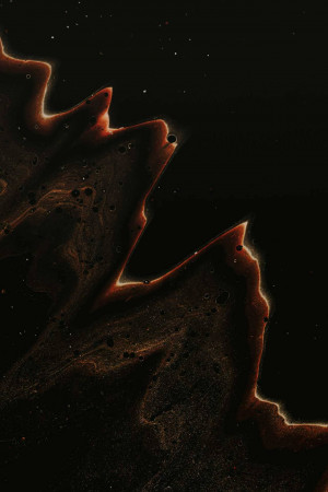 Abstract close-up of red and black fluid art with swirling patterns