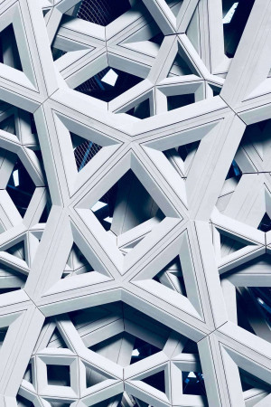 Close-up of a modern building facade with a geometric pattern.