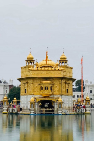 The Golden Temple, a Sikh Gurdwara, reflected in the surrounding water.