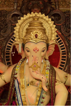 Close-up of a beautifully decorated Ganesha idol with intricate details.