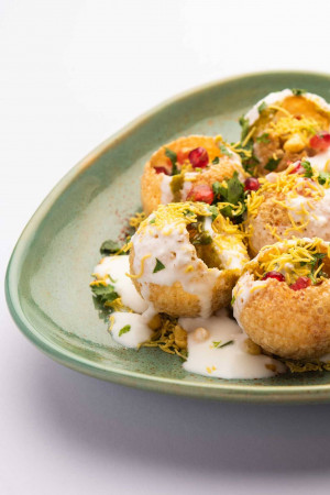 Close-up of Pani Puri served on a green plate