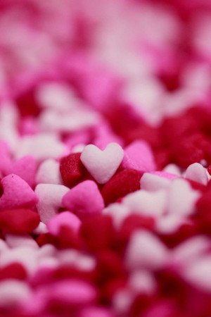 Close-up of pink and white heart-shaped sprinkles
