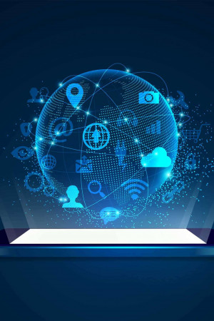 A futuristic depiction of a globe with various digital icons floating around it, resting on a laptop screen.