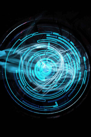 Abstract digital art with glowing blue circular patterns and light streaks.
