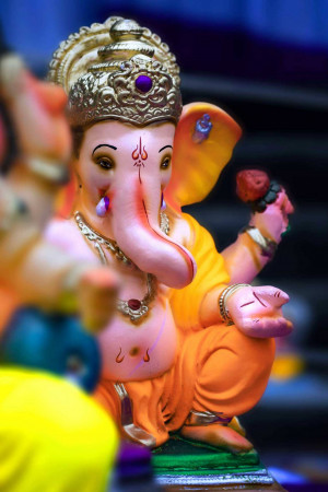 Close-up of a vibrant and intricately decorated Lord Ganesha idol