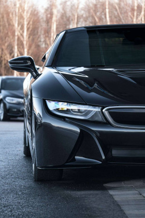 Close-up of a black BMW i8 parked on the side of a road