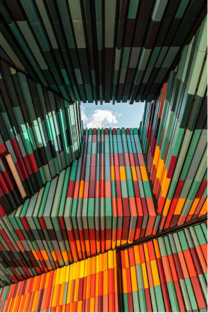Abstract view of a colorful building facade with a glimpse of the sky